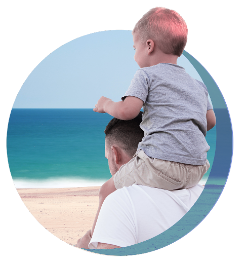 A sweet moment captured as a baby sits happily on the father's back, delighting in a piggyback ride.