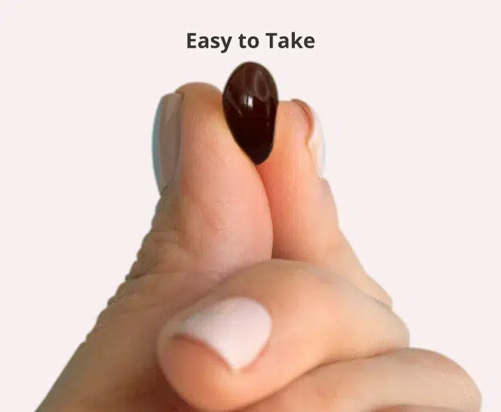 Finger holding the small pill with "Easy to Take" caption